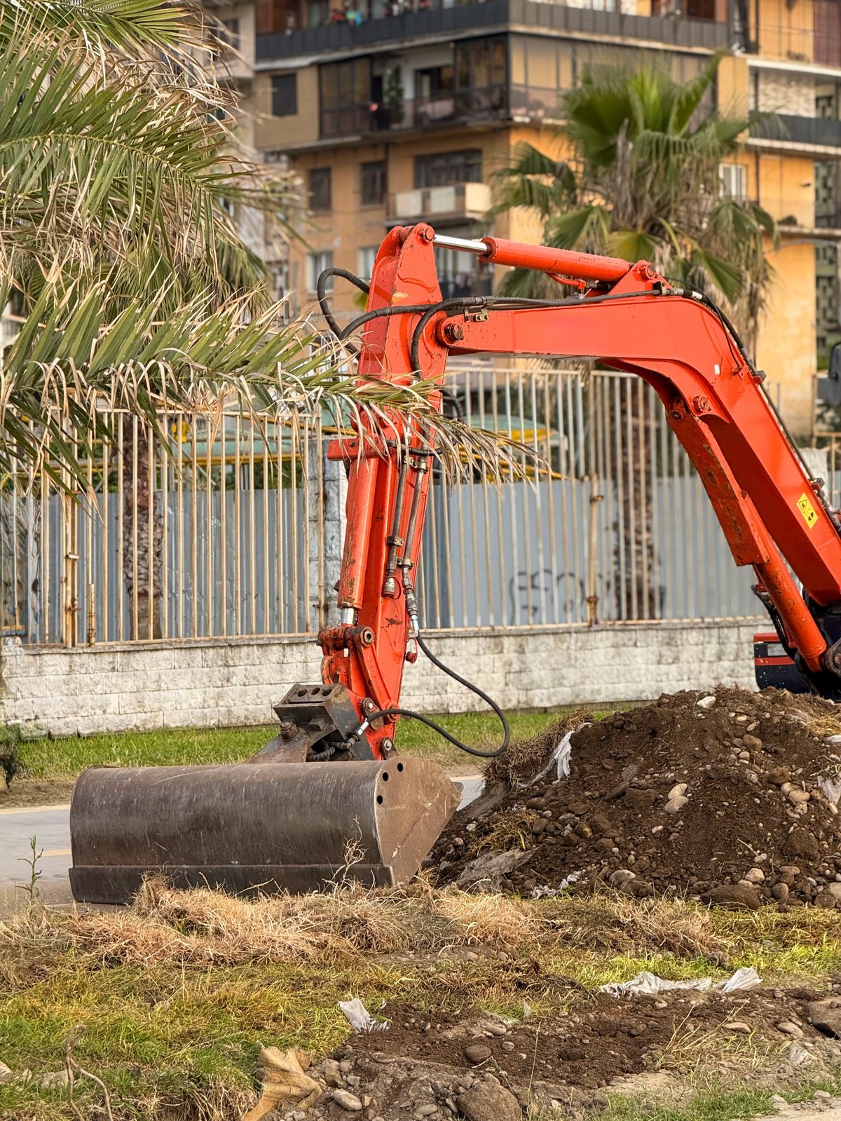 Excavator moving earth and dirt on a worksite